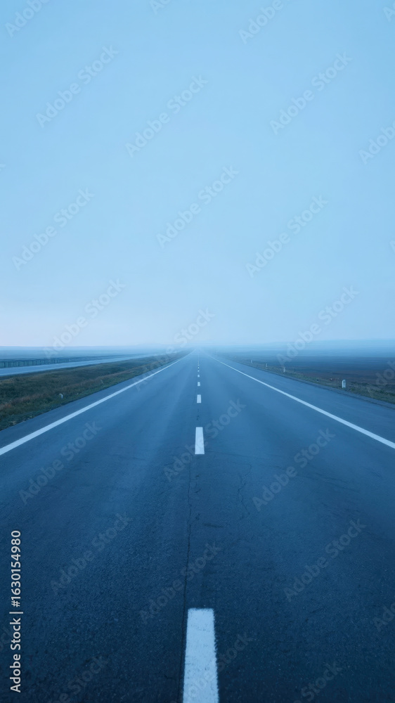 Fototapeta premium Straight Highway Stretching into the Horizon under a Clear Sky