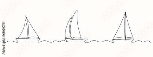Three sailboats gliding on wavy water sailing ocean