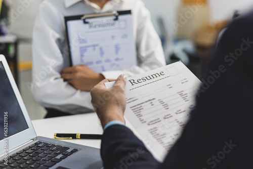 Tableau sur toile Employer reviewing resume during job interview in office