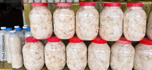 Sour bamboo shoots or preserved bamboo shoots are placed in a plastic jar and the lid is tightly closed. Fresh bamboo shoots are pickled with salt and waterto extend their shelf life, enhance flavor.
