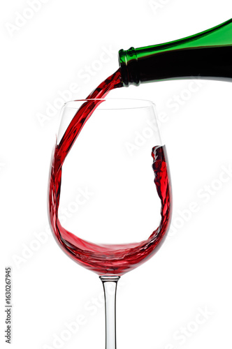 Red Wine being poured into a glass against a white background, close up
