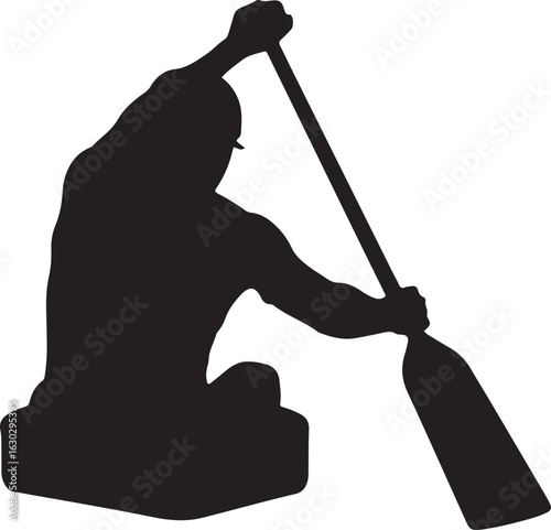 A silhouette of a kayaker paddling with a strong forward stroke in a kayak