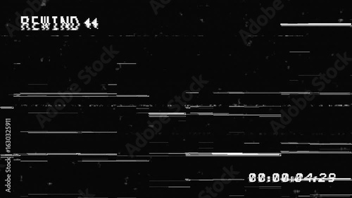 VHS tape rewind glitched on black background. 4K Video