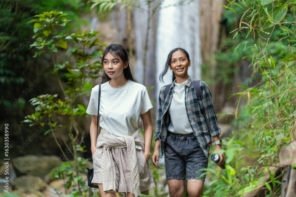 Asian Indonesian Women Hiking Near Grojogan Sewu Waterfall in Yogyakarta Jungle Asian Indonesian Women Hiking Near Grojogan Sewu Waterfall in Yogyakarta Jungle
