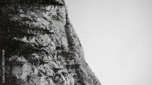 A Majestic SnowCovered Mountain Peak Displayed in Striking Monochrome Photography
