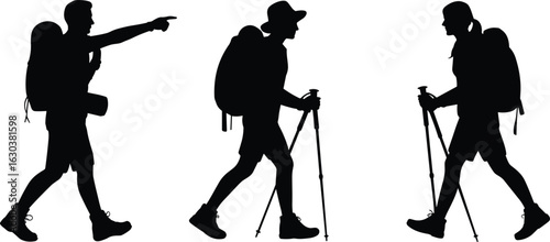 Three hikers with backpacks and trekking poles hiking