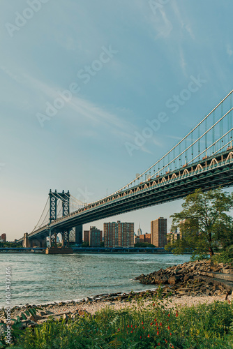 Classic view of the Manhattan Bridge and the Lower Manhattan skyline at daytime, seen from Brooklyn, New York City.