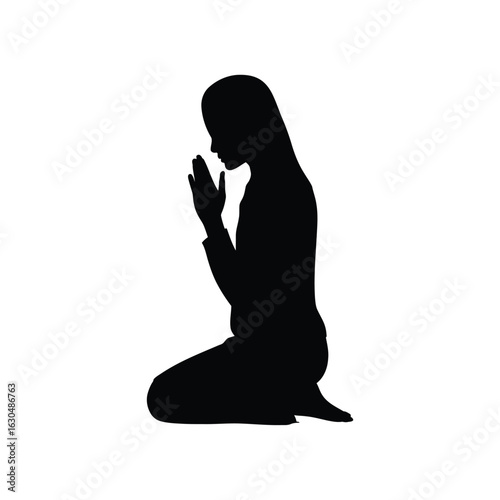 Woman praying kneeling silhouette hands