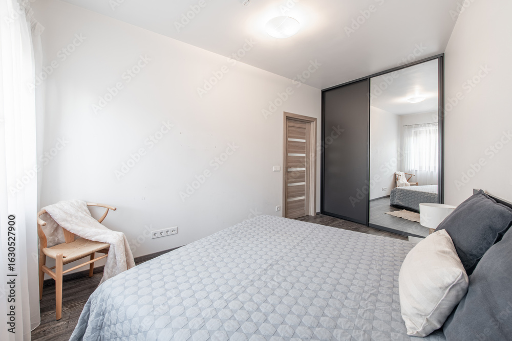 Fototapeta premium Modern Home Bedroom Interior with Minimalist Style and Cozy Ambiance