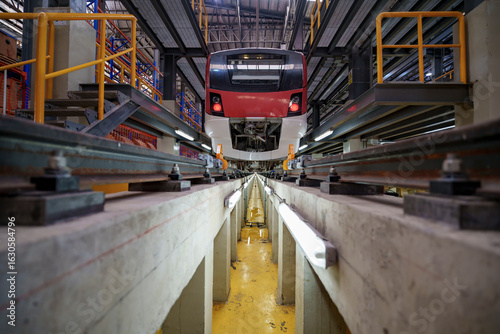 Modern train maintenance facility with overhead train checks and extensive rail infrastructure