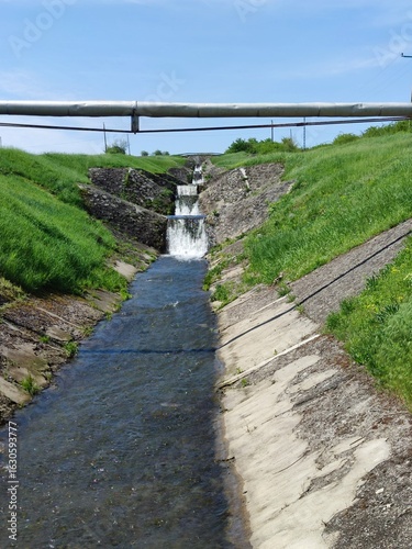 Wallpaper Mural Stepped Concrete Drainage Channel with Flowing Water in Rural Hungary Torontodigital.ca