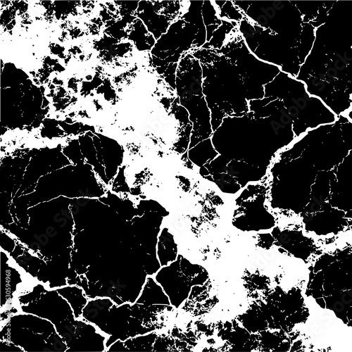 Abstract black and white image showing a cracked or marbled texture with contrasting areas of color