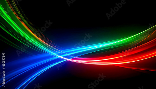Crossed beams of blue, red and green spectrum light on a black background