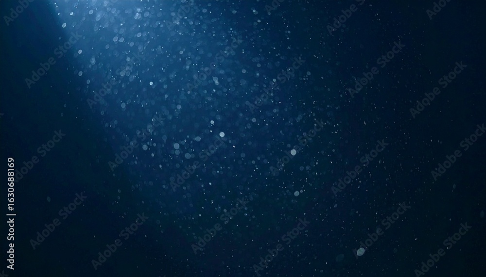 Fototapeta premium Floating dust particles illuminated by a single cinematic beam of light on a dark gradient background