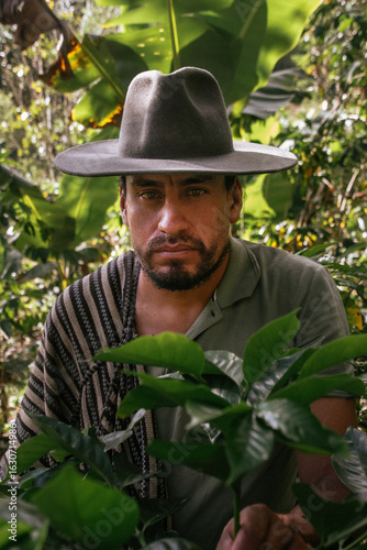 Male farmer harvesting on his coffee plantation