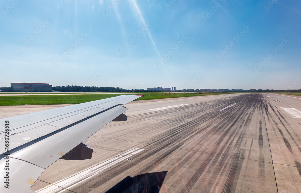 Fototapeta premium View from the airplane window during takeoff at Sheremetyevo airport at summer