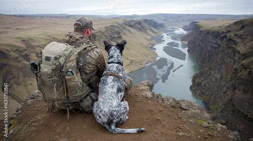Hunter and their dog in natural landscape. Traditonal and conservational scene. Moments of nature and rural lifestyle, conservation and autumn field scenes