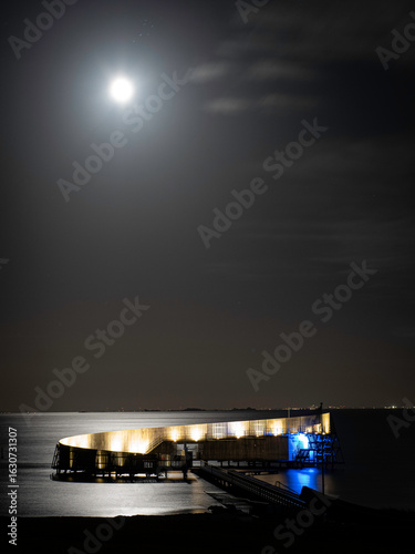 Moonlight shining on the Øresund sea at Kastrup Strandpark in Denmark