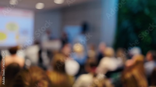 Wallpaper Mural A Blurred View of Conference Attendees Gathered Together at a Busy Event Venue and Engaging in Conversations Torontodigital.ca