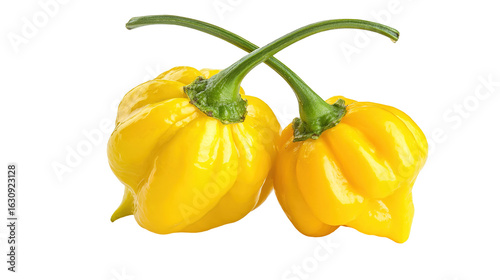 Green bell pepper and cutting board on wooden table overhead in studio
