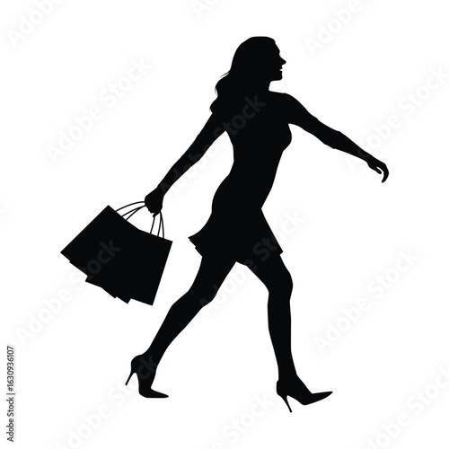 Silhouette of Woman Shopping With Shopping Bags in Hand