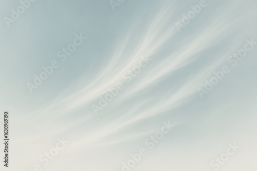 Wispy Cirrus Clouds in a Pale Blue Sky.