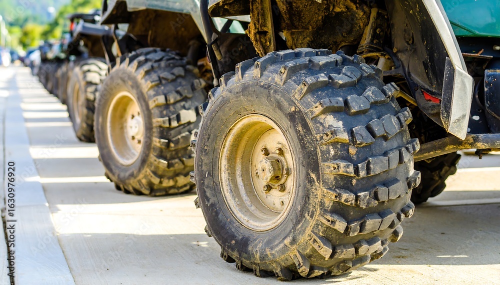 ATV tires lined up on a road ATV tires lined up on a road