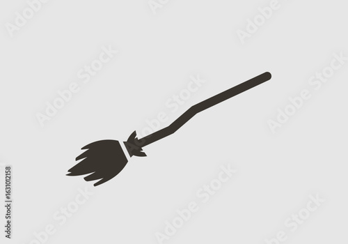 A simple silhouette icon of a witch's broomstick. A symbol of magic, witchcraft, and fantasy, perfect for Halloween designs.