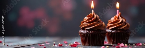 Two chocolate cupcakes, candles, colorful frosting, miniature-cakes, high-resolution, delicious