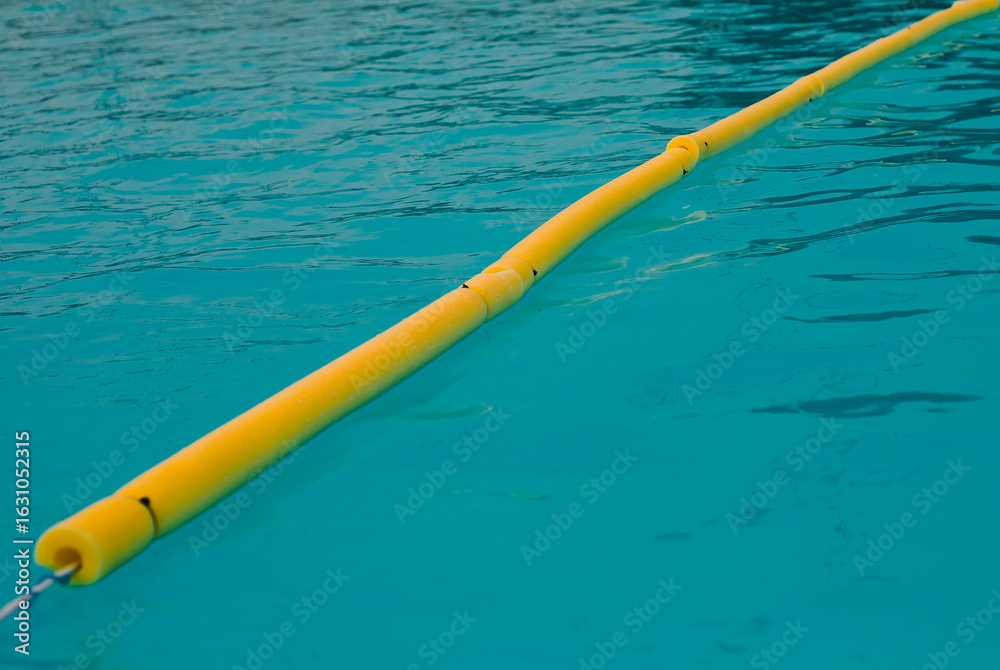 Naklejka premium Blue clear water in a filled swimming pool surface texture reflection