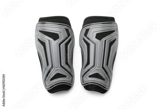 Top view of protective football shin pads. Sporting equipment for leg safety during a match, isolated on white background.