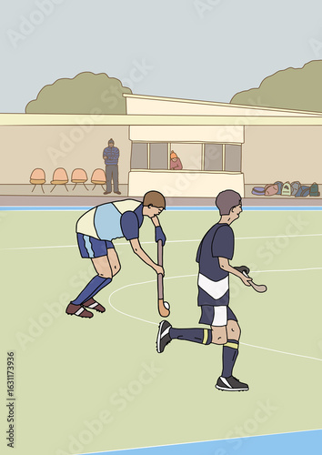 Two teenage boys playing competitive hockey on field