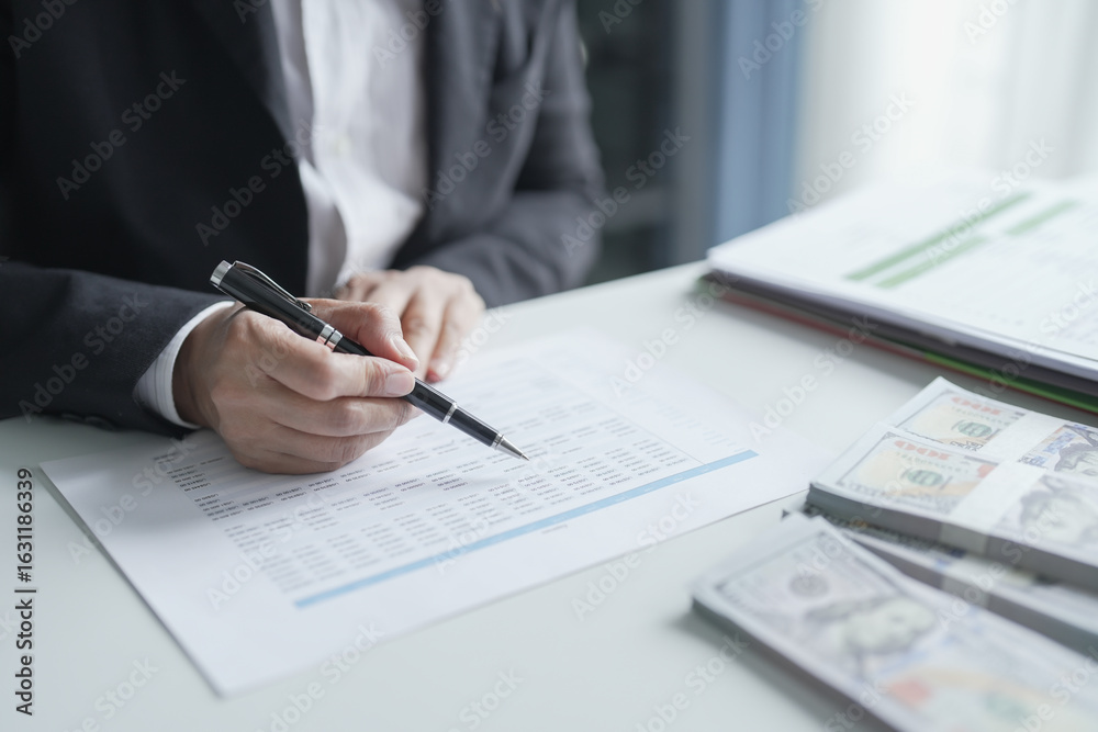 Fototapeta premium Businesswoman Accountant analyzing investment charts Invoice documents. Accounting Bookkeeper Clerk&nbsp;Bank Advisor And Auditor