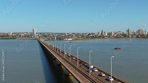 Wallpaper Mural Elevated highway San Roque González de Santa Cruz bridge over Paraná river with cars and distant city skyline, Paraguay, Argentina. Torontodigital.ca