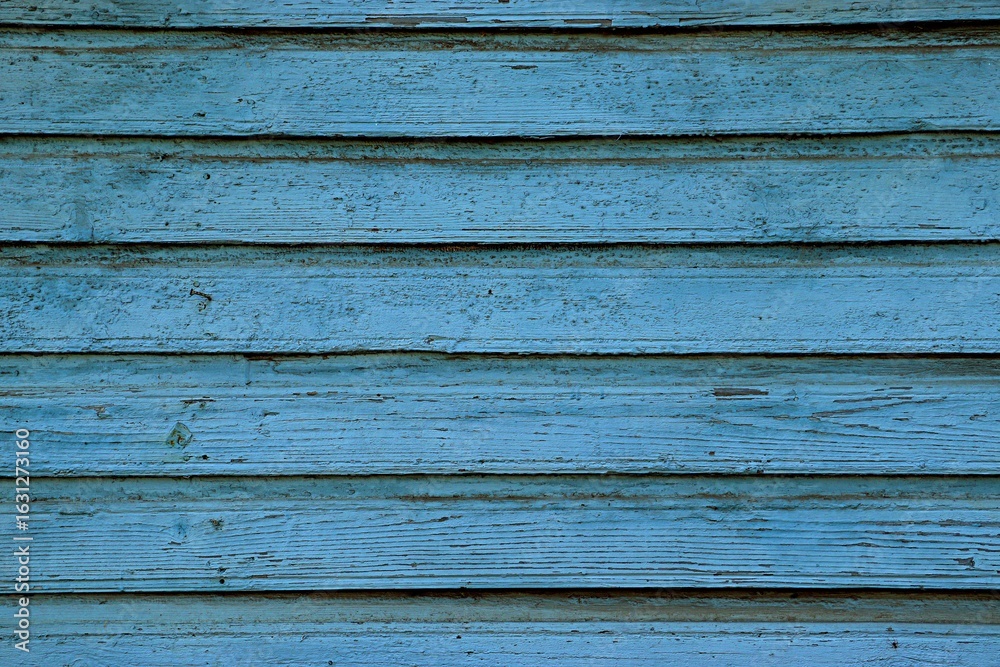 Fototapeta premium Background, texture wooden planks on the wall nailed overlapping painted with blue paint