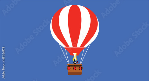 Hot air balloon floating, using burner, against blue sky, for travel or advertisement