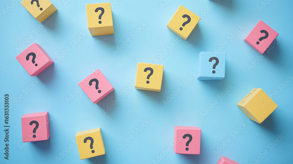 Colorful blocks with question marks scattered on blue background symbolizing questions or uncertainty Colorful blocks with question marks scattered on blue background symbolizing questions or uncertainty