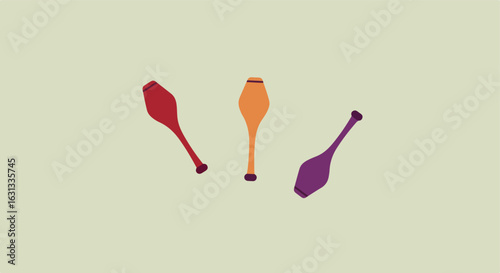 Juggling clubs props laid on a flat background for a circus performance promo