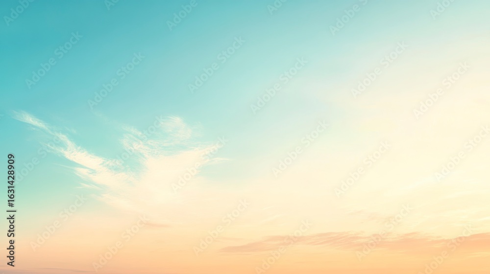 Fototapeta premium Soft pastel sunset sky with wispy clouds.