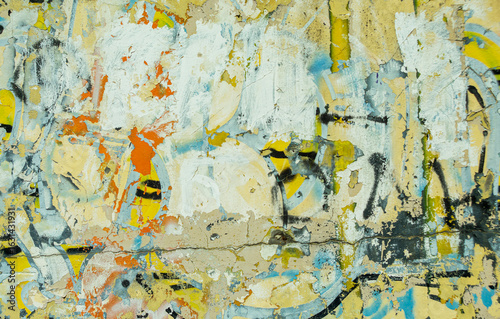 Obraz na plátně Abstract: crumbling graffiti on a city street wall