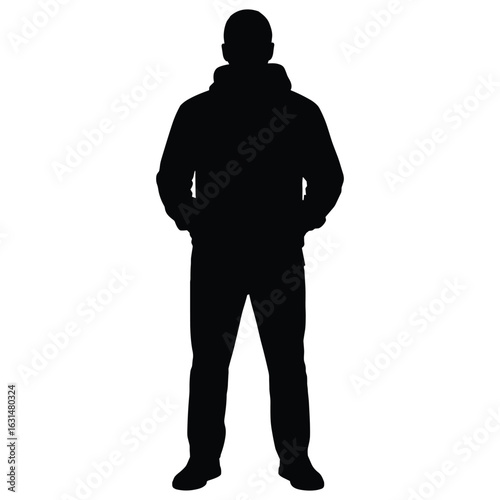 Man in hoodie standing with hands in pockets silhouette