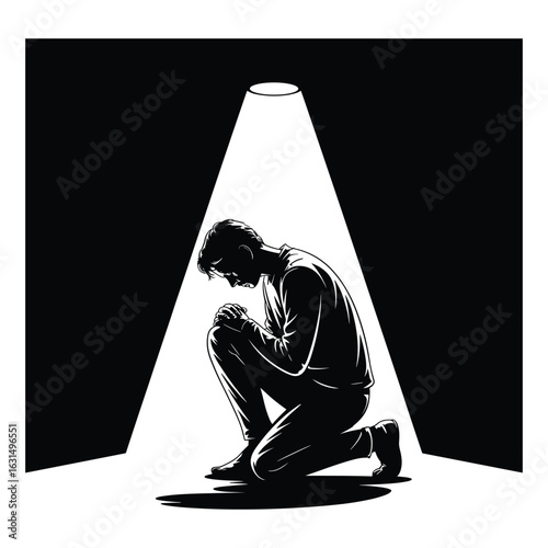 Man kneeling in spotlight silhouette