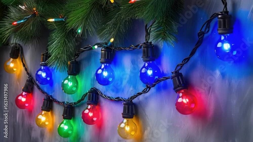 A garland of vibrant holiday lights strung on a fence.