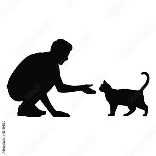 Person crouching down reaching out to a cat silhouette