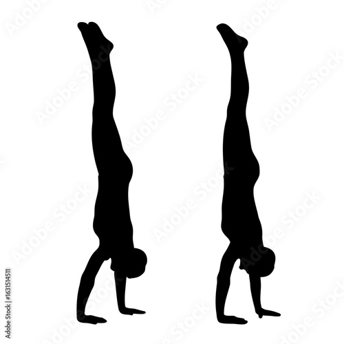 Two gymnasts performing handstands silhouette