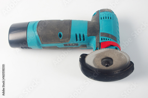 Portable grinder with saw blade.