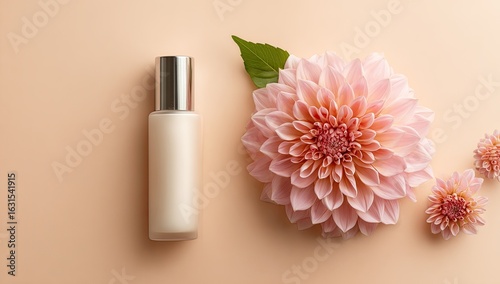 Pastel cream bottle and pink flower arrangement on a light peach background