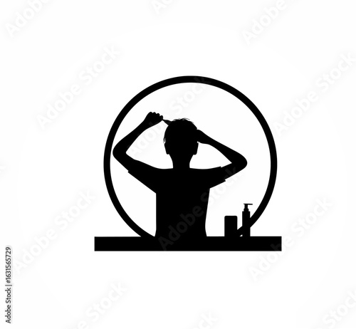 Young boy brushing his hair in the morning getting ready for the day