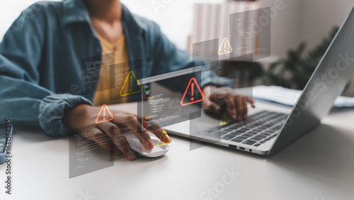 Laptop showing coding errors and warning icons, symbolizing hacker attack, phishing, cyber threat, and malware. Concept for cybersecurity, digital risk, and system vulnerability protection.