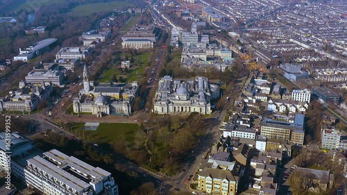 4K drone panorama of Cardiff’s Cathays Park civic centre - City Hall, National Museum Cardiff and Alexandra Gardens - framed by tree lined boulevards, Victorian terraces and the Welsh capital skyline.